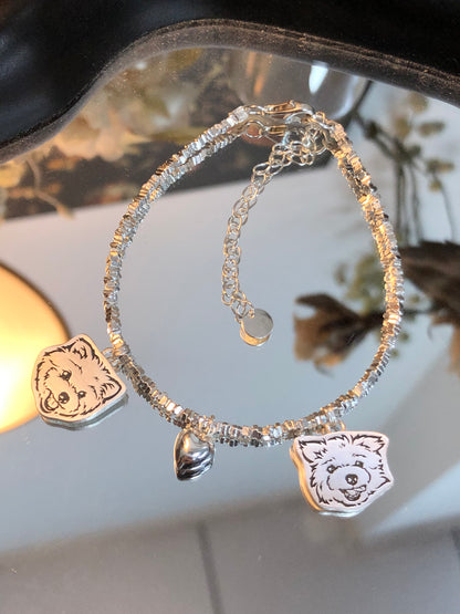 Close-up of the Two Dog Pendants and the Heart Pendant on our Crushed Silver Pet Face Bracelet