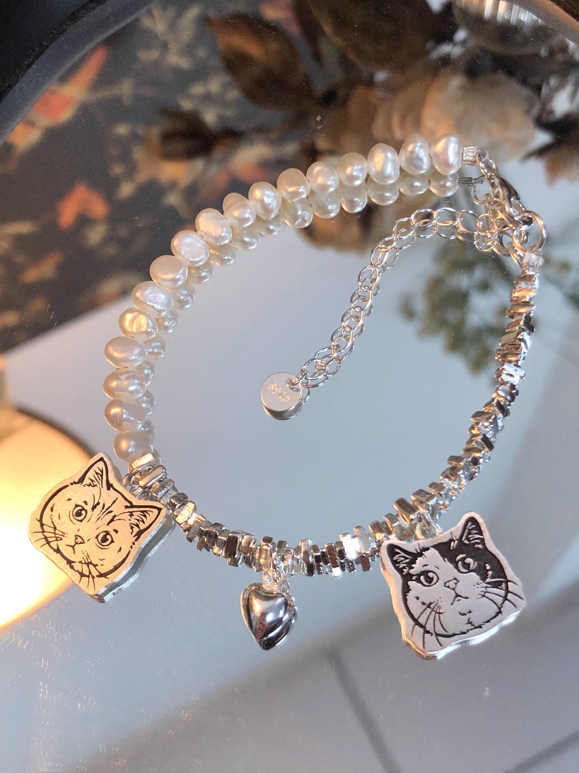Close-up of the Two Pendants and the Heart Pendant on our Cat Pearl Pet Face Bracelet